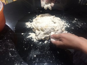 Slapping down dough on the bench top ... great for anger management.